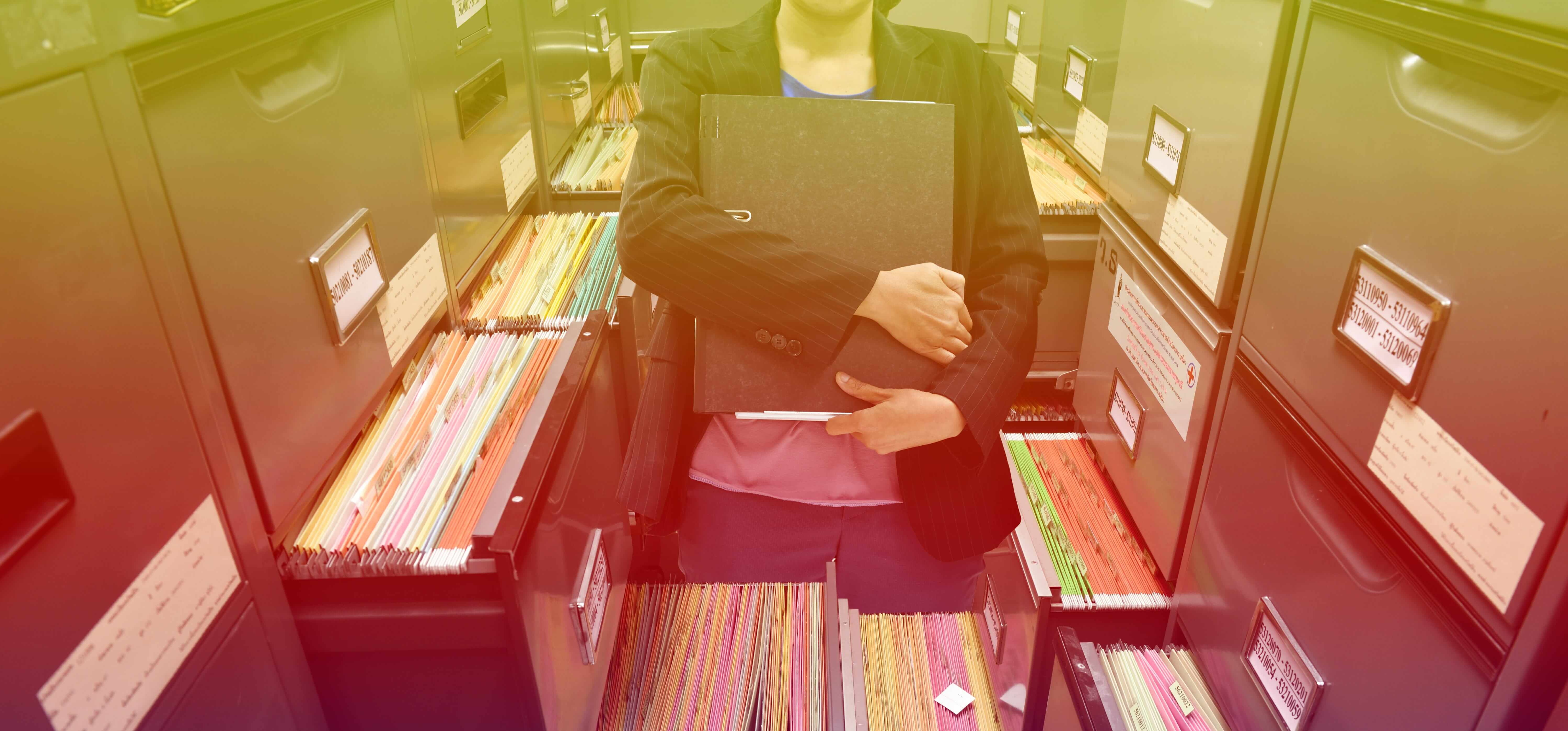 Small business secretary or personal assistant dealing with documents